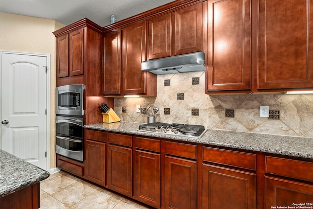 kitchen featuring tasteful backsplash, light stone counters, light tile patterned floors, and stainless steel appliances