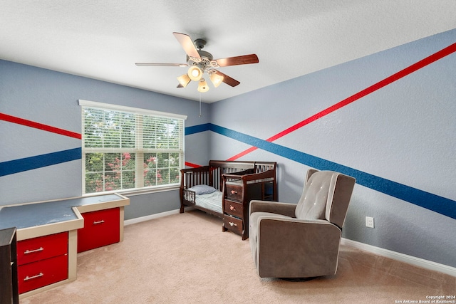 living area with light colored carpet and ceiling fan