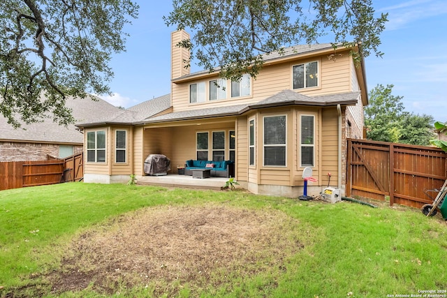 rear view of house with a patio, an outdoor hangout area, and a lawn