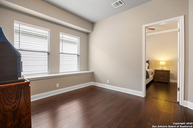 bedroom featuring dark hardwood / wood-style floors