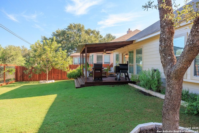 view of yard with ceiling fan