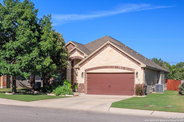 view of front of house featuring central AC, a front lawn, and a garage