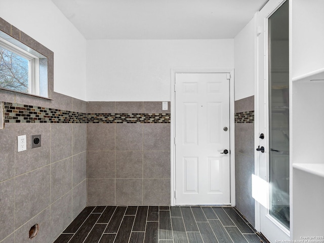 bathroom with tile walls