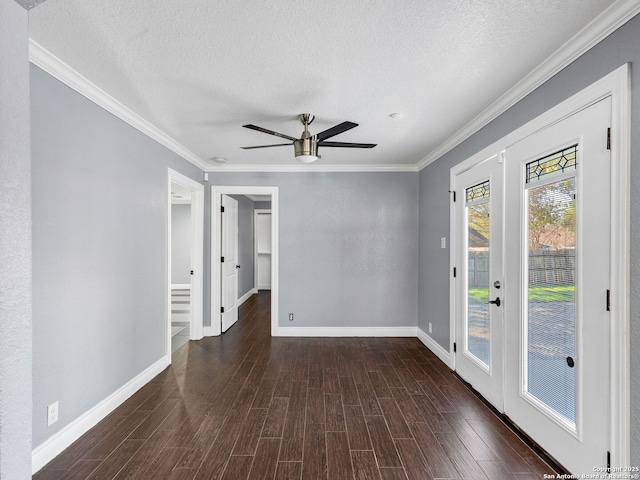 spare room with french doors, ceiling fan, crown molding, and a textured ceiling