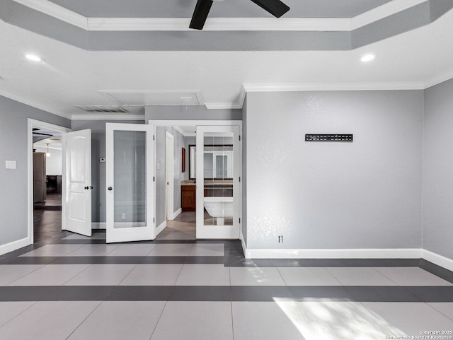 spare room featuring crown molding, french doors, and dark tile patterned floors