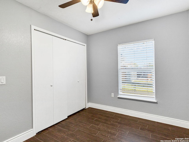 unfurnished bedroom with a closet and ceiling fan