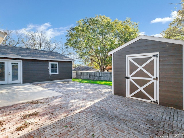 view of patio / terrace featuring a shed