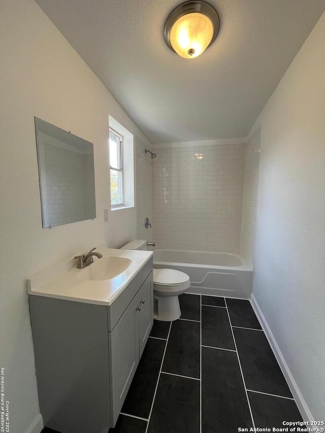 full bathroom with vanity, tile patterned floors, a textured ceiling, and toilet