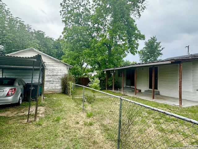 view of yard with a carport