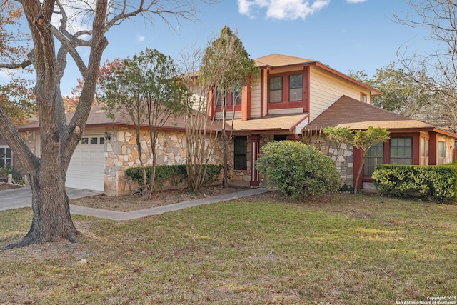 view of front of property with a front lawn and a garage