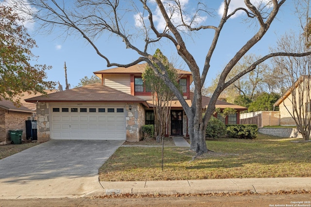 view of front of property with a garage and a front yard