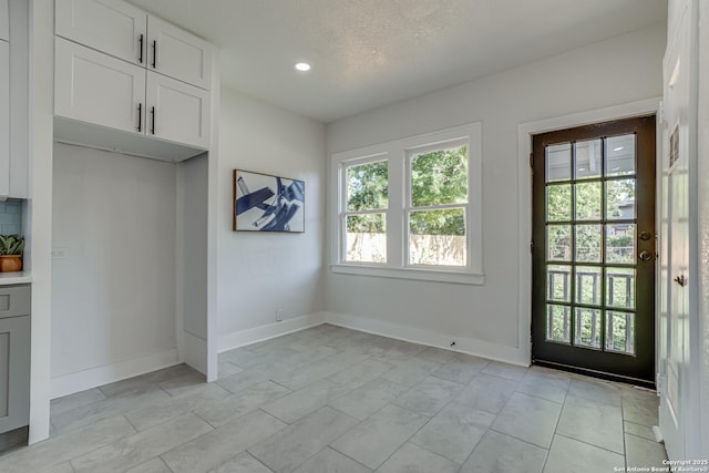 interior space featuring a textured ceiling