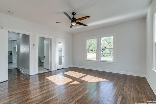 empty room featuring ceiling fan and dark wood-type flooring