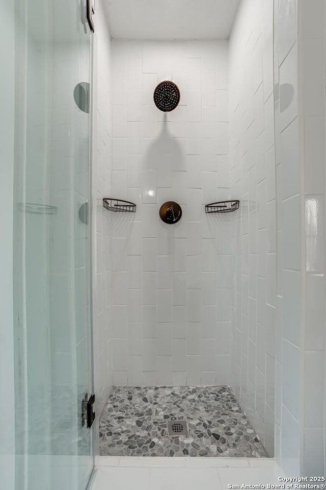 bathroom featuring an enclosed shower