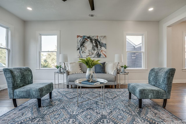 sitting room with dark hardwood / wood-style flooring