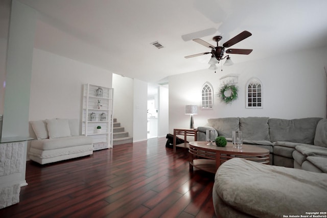 living room featuring ceiling fan and dark wood-type flooring