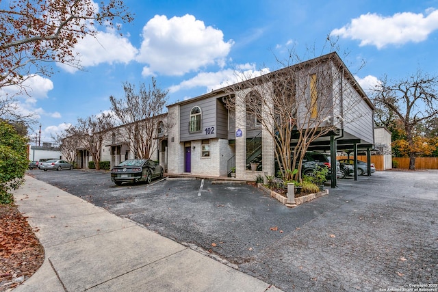 view of building exterior featuring a carport