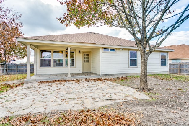 rear view of house featuring a patio area and ceiling fan