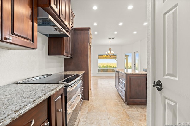 kitchen with ventilation hood, decorative light fixtures, electric range, light stone countertops, and a notable chandelier