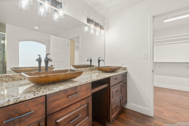 bathroom featuring vanity and walk in shower