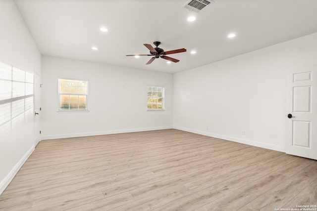 empty room with light hardwood / wood-style flooring and ceiling fan