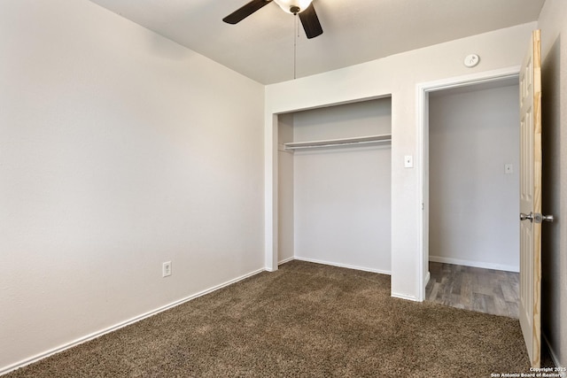 unfurnished bedroom with a closet, dark carpet, and ceiling fan