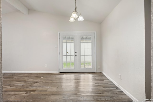 interior space featuring vaulted ceiling with beams, french doors, a chandelier, and dark hardwood / wood-style flooring