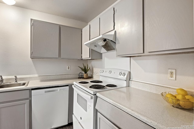 kitchen featuring gray cabinetry, white appliances, and sink