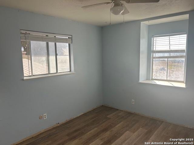 unfurnished room featuring hardwood / wood-style flooring and ceiling fan