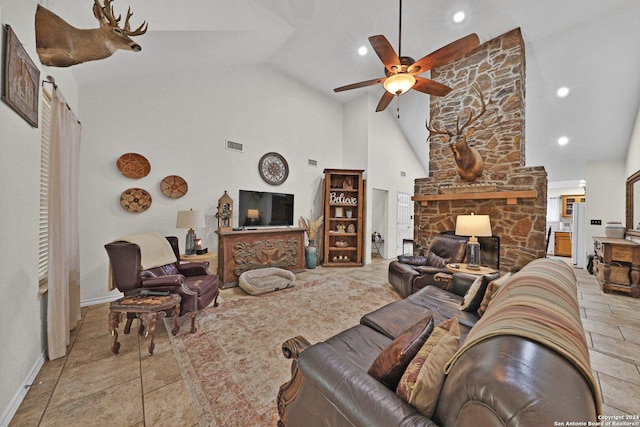 living room featuring a fireplace, high vaulted ceiling, and ceiling fan