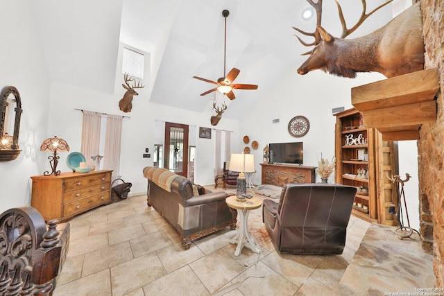 living room with ceiling fan, french doors, and high vaulted ceiling