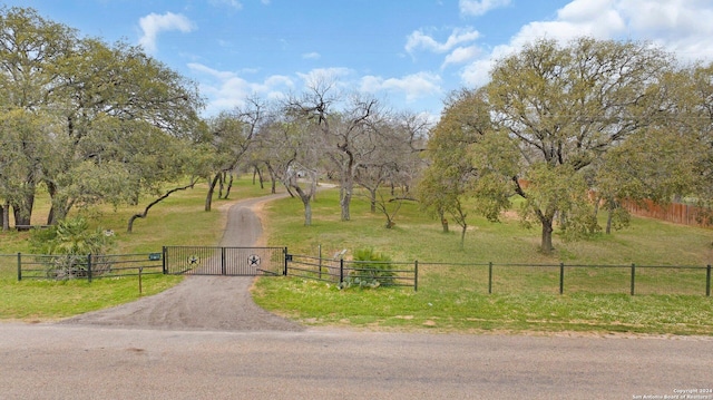 exterior space featuring a yard and a rural view