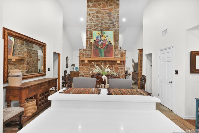 dining room with high vaulted ceiling