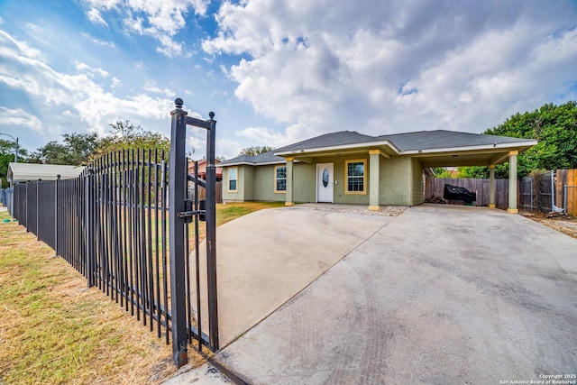 view of front of home with a carport