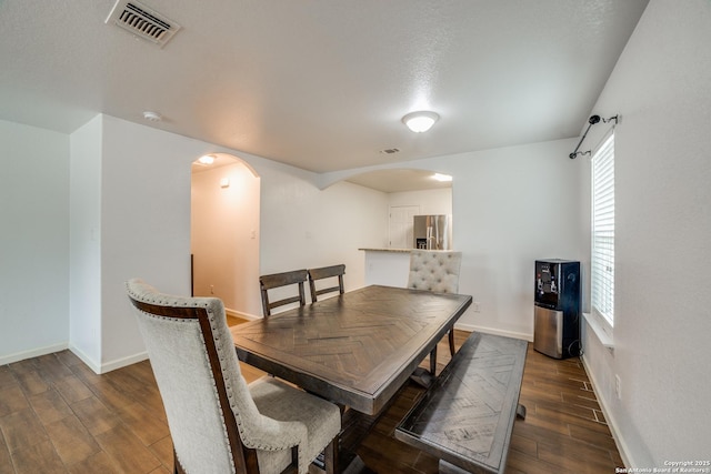 dining space featuring a textured ceiling