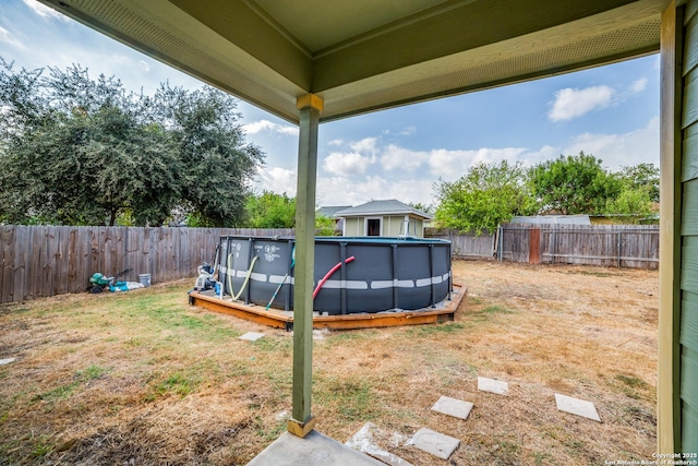 view of yard featuring a fenced in pool