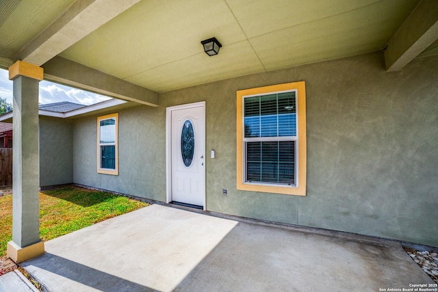 doorway to property with a patio