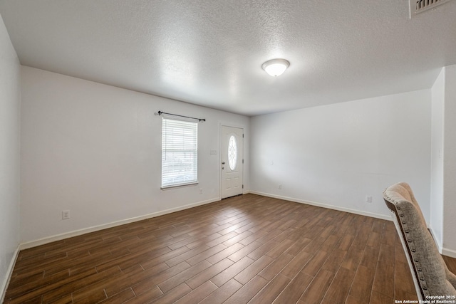 entrance foyer with a textured ceiling