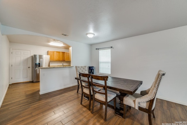 dining room featuring dark hardwood / wood-style flooring