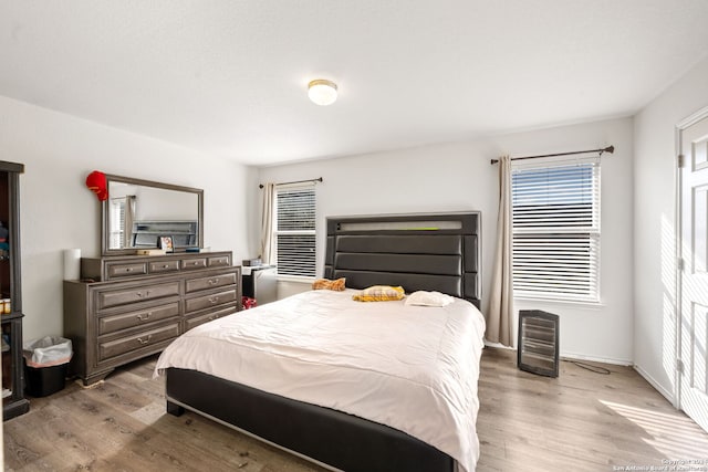 bedroom featuring light wood-type flooring