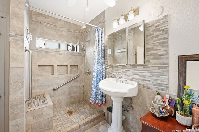 bathroom with curtained shower, decorative backsplash, and ceiling fan