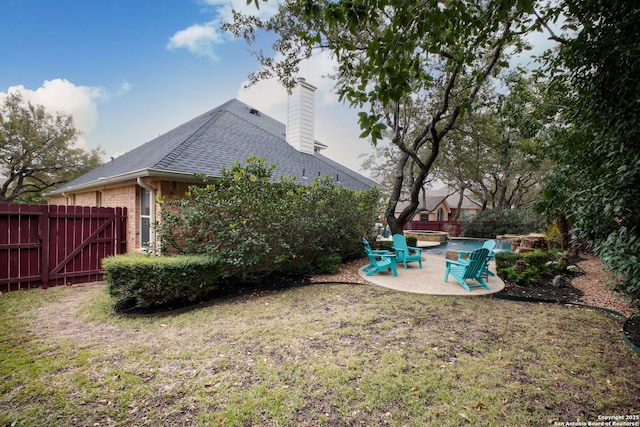 view of yard with a patio and a fire pit