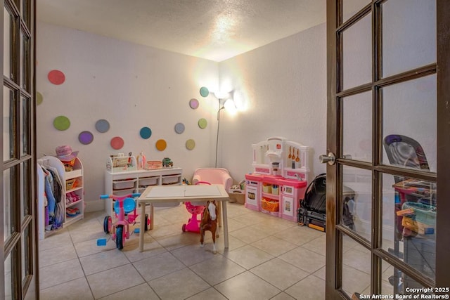 playroom with light tile patterned floors