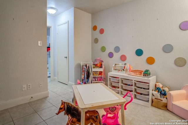 game room featuring light tile patterned floors