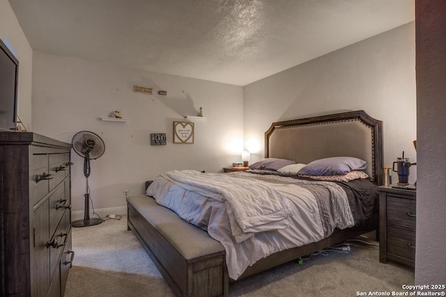 bedroom featuring light carpet