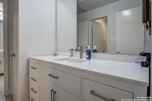 bathroom featuring tile patterned floors and vanity