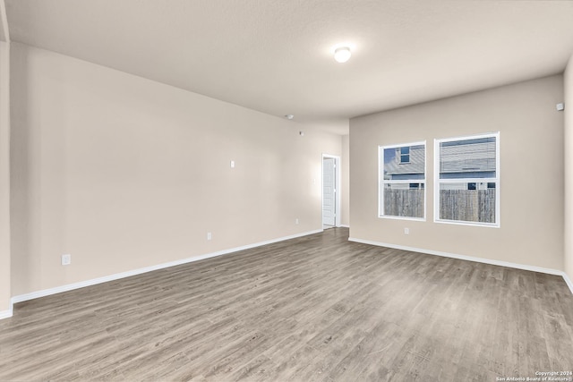 empty room featuring wood-type flooring