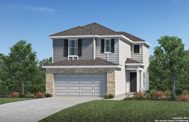 view of front of house featuring a front yard and a garage