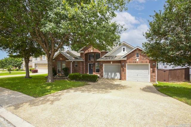 view of front facade featuring a front yard and a garage