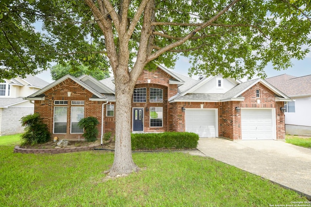 view of front of home with a garage and a front lawn